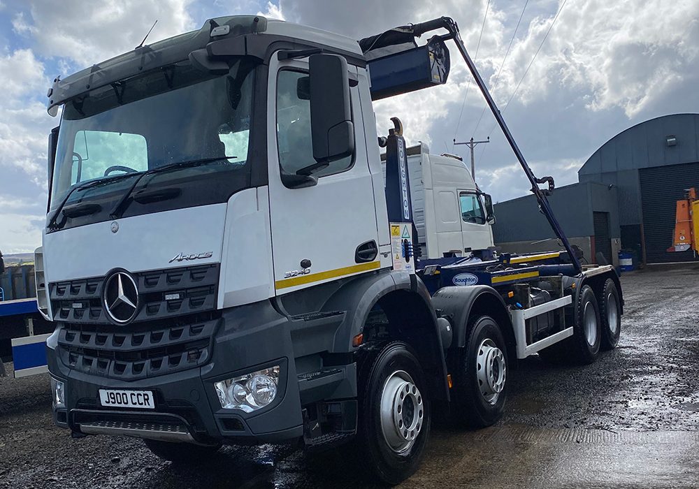 White, blue and yellow recovery vehicle
